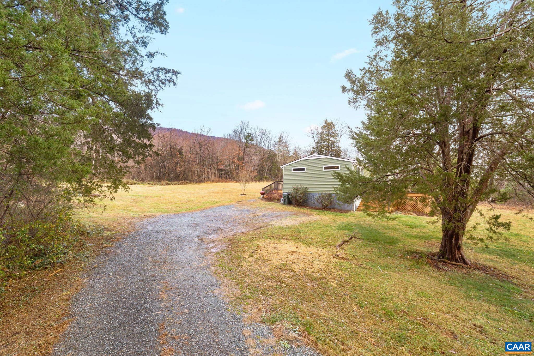 504 Newtown Road Greenwood, VA 22943 - Photo 22 of 34 a view of yard with swimming pool and trees