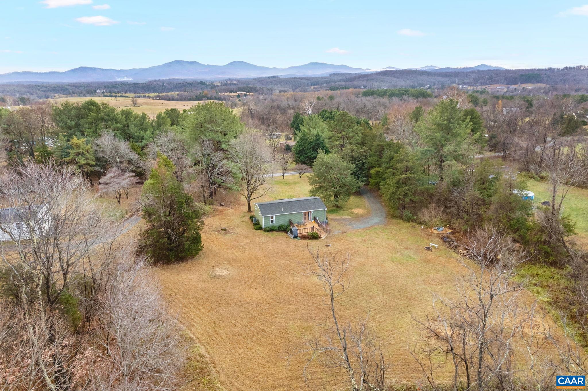 504 Newtown Road Greenwood, VA 22943 - Photo 26 of 34 a view of a lush green field with mountains in the background