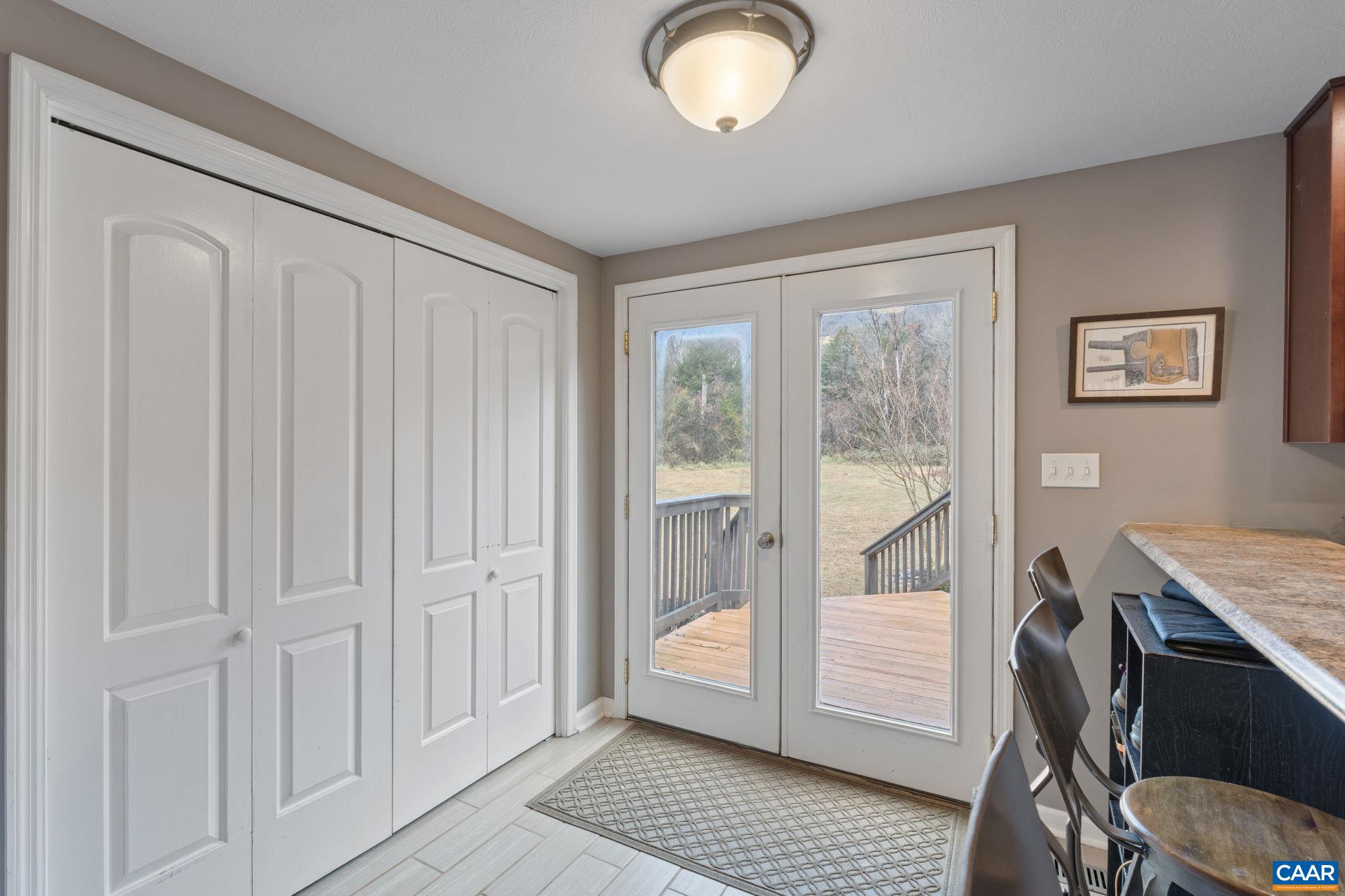 504 Newtown Road Greenwood, VA 22943 - Photo 7 of 34 a view of a hallway with bathroom and wooden floor