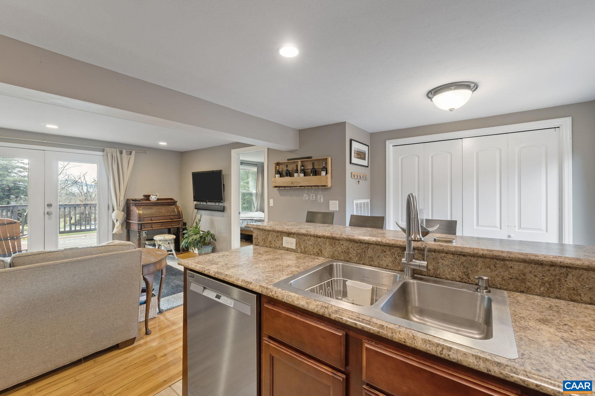 504 Newtown Road Greenwood, VA 22943 - Photo 10 of 34 a kitchen with sink refrigerator and large window