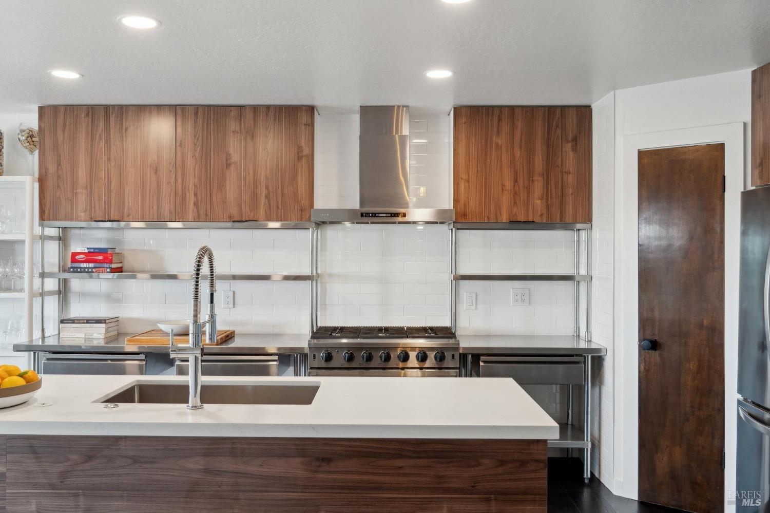 3485 Ridgeview Drive Santa Rosa, CA 95404 - Photo 12 of 63 a kitchen with wooden cabinets and a sink