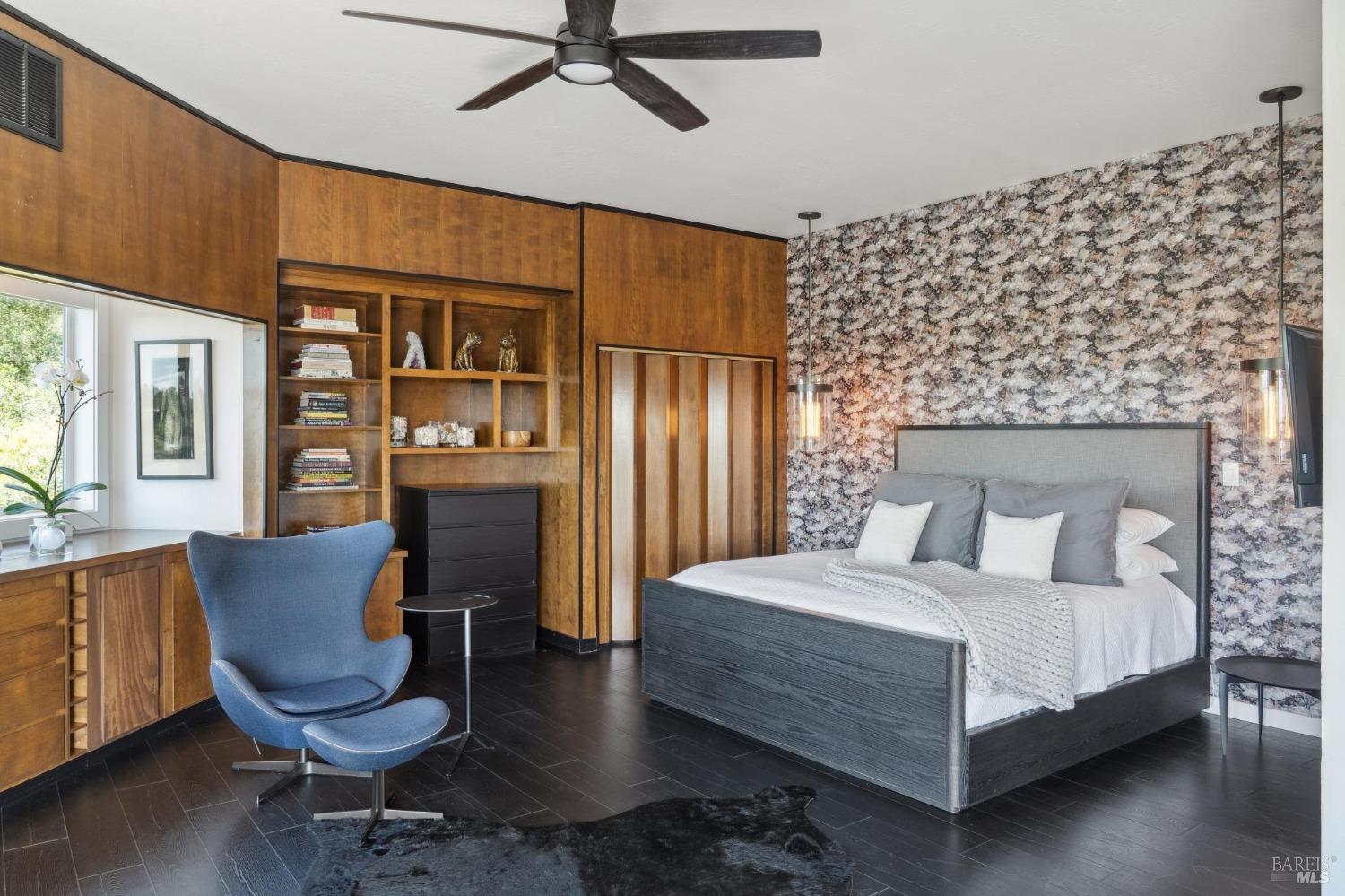 3485 Ridgeview Drive Santa Rosa, CA 95404 - Photo 24 of 63 a bedroom with a bed wooden floor and lamp