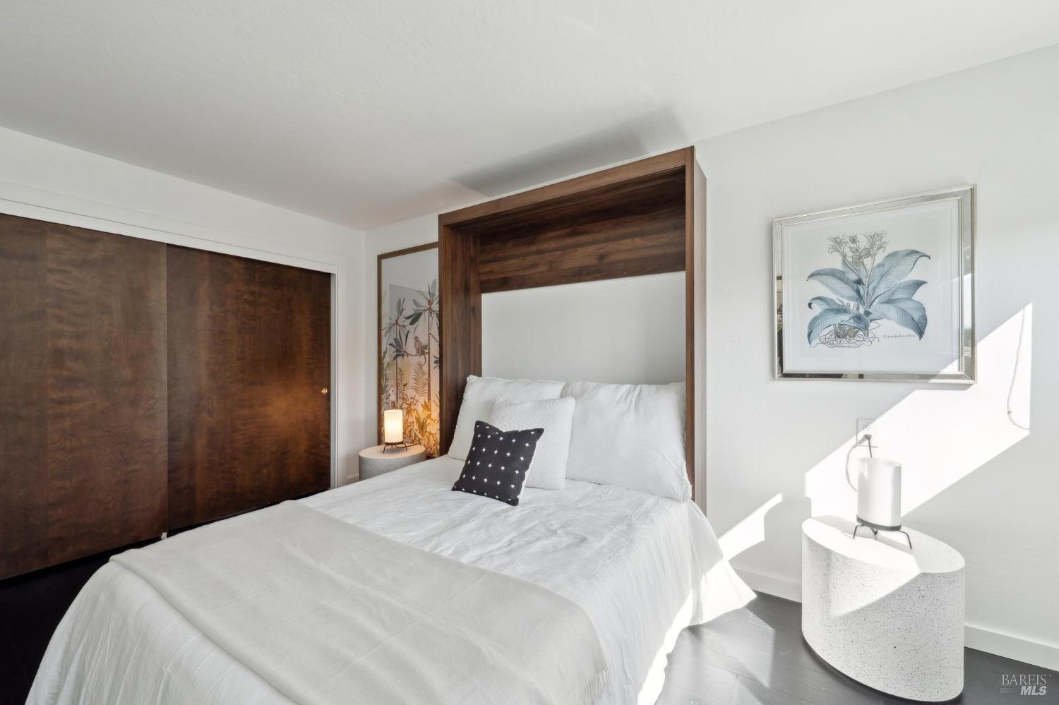 3485 Ridgeview Drive Santa Rosa, CA 95404 - Photo 38 of 63 a bedroom with a bed and a painting on the wall