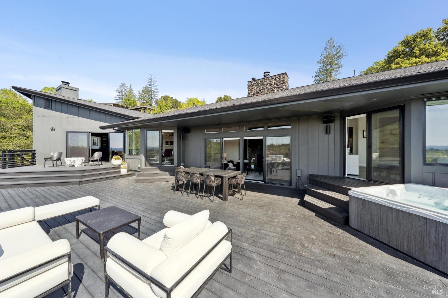 3485 Ridgeview Drive Santa Rosa, CA 95404 - Photo 41 of 63 a view of a patio with dining table and chairs with wooden floor and plants