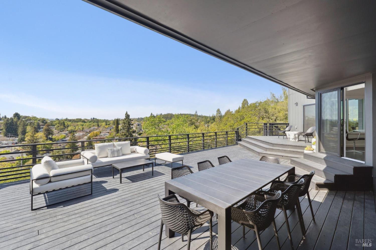 3485 Ridgeview Drive Santa Rosa, CA 95404 - Photo 44 of 63 a view of a balcony with chairs and wooden floor