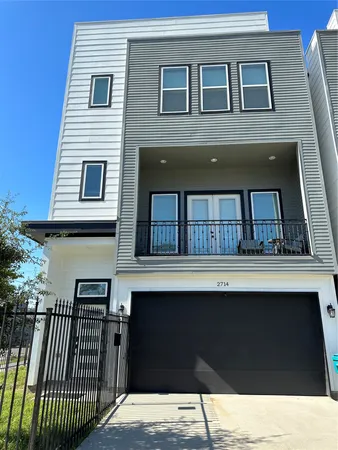 a side view of a house with a balcony