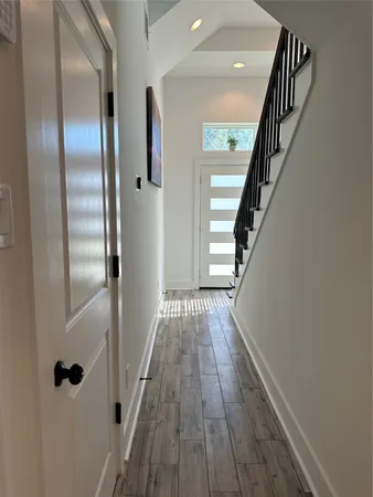a view of entryway with wooden floor