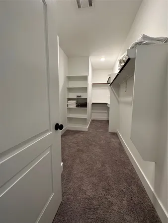 a view of an empty walk in closet