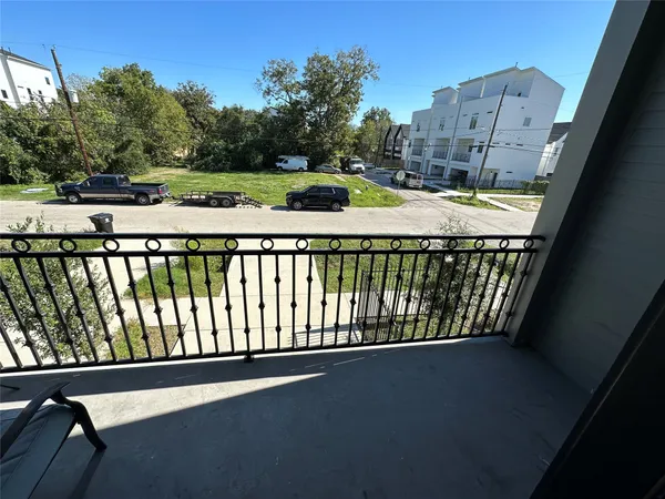 a view of balcony with a yard