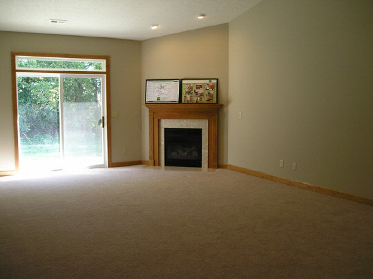 10353 Marblewing Road Roscoe, IL 61073 - Photo 2 of 4 a view of an empty room with a fireplace