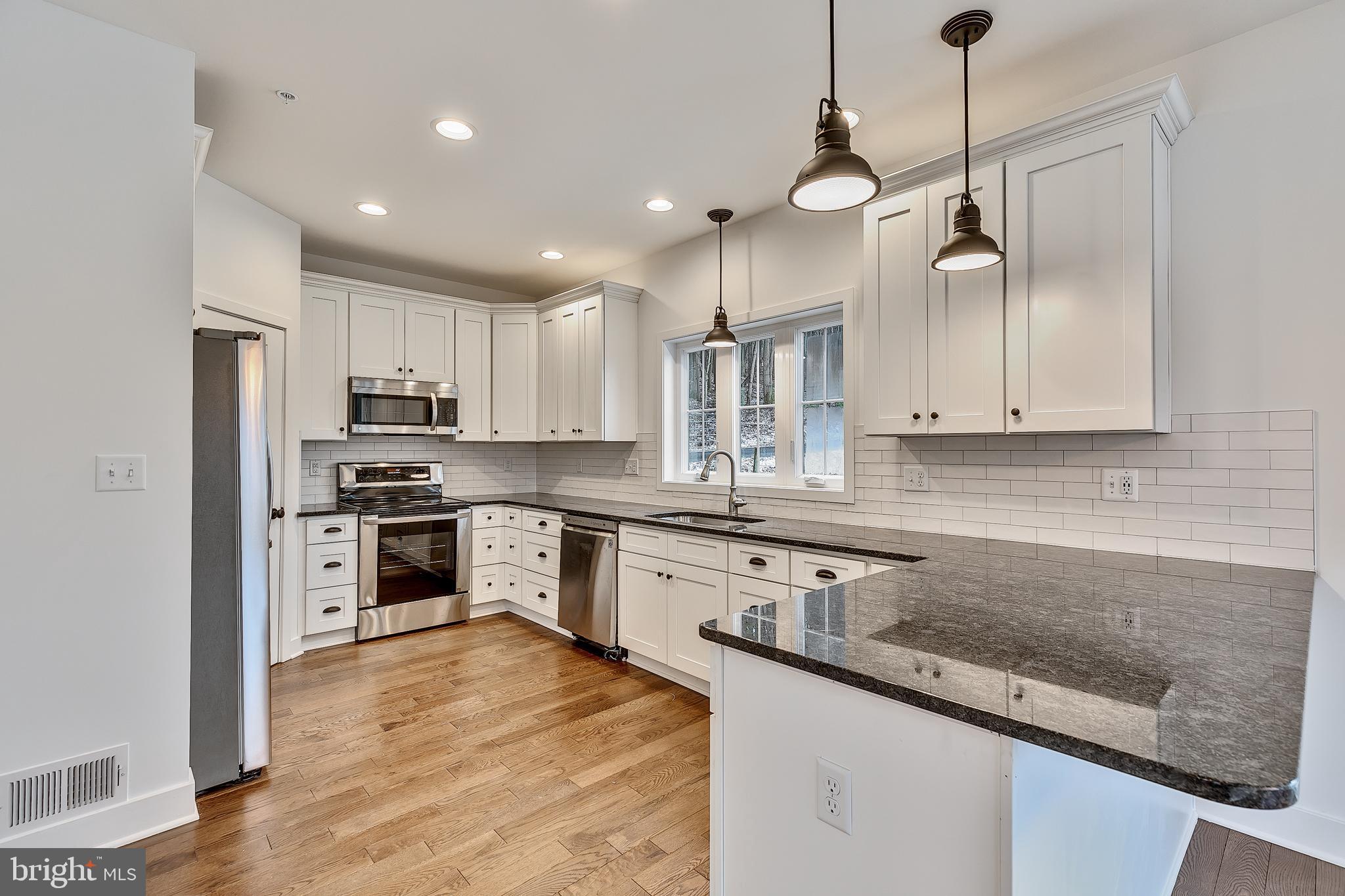 5403 Buffalo Road Mount Airy, MD 21771 - Photo 10 of 31 Kitchen With Seating/ Dark Granite Counter tops