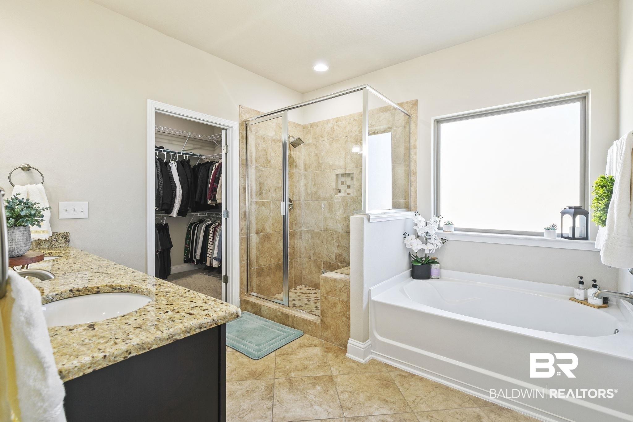 31500 Spoonbill Road Daphne, AL 36527 - Photo 28 of 85 Bathroom with vanity, tile patterned flooring, and separate shower and tub