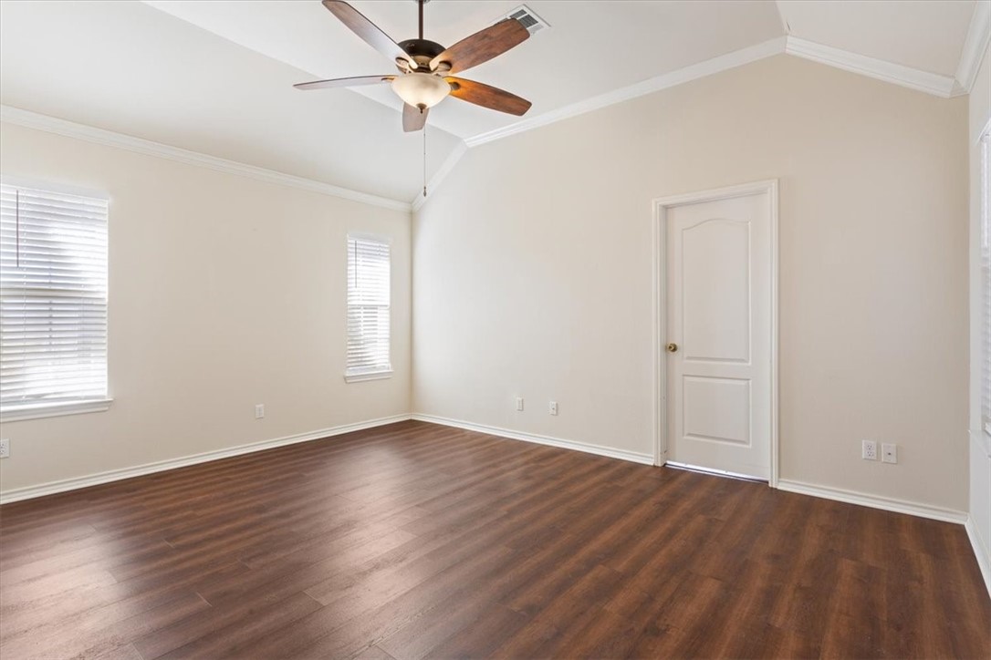 306 Baker Lane Robinson, TX 76706 - Photo 16 of 28 an empty room with wooden floor fan and windows