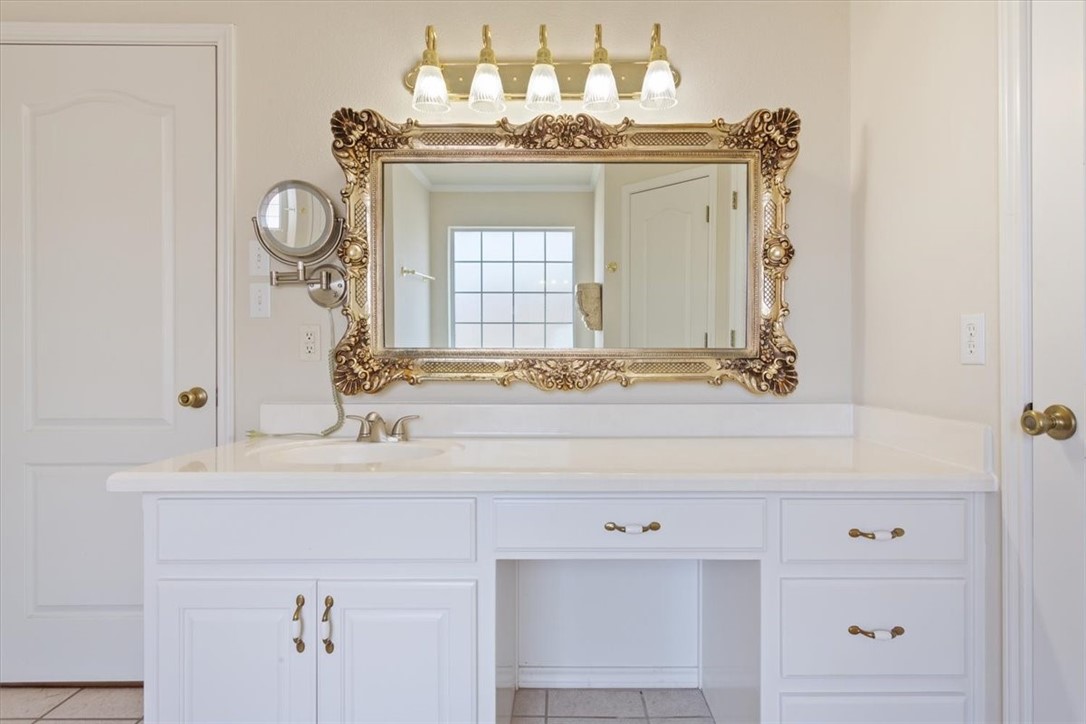 306 Baker Lane Robinson, TX 76706 - Photo 17 of 28 a bathroom with a sink vanity and a mirror
