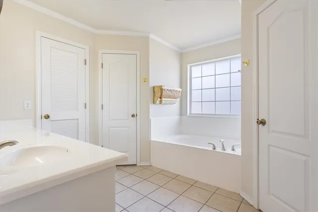 a bathroom with a bathtub and a sink