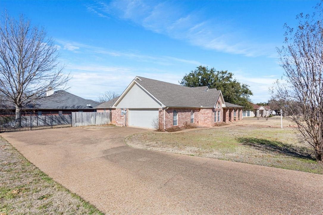 306 Baker Lane Robinson, TX 76706 - Photo 2 of 28 a view of house with outdoor space and trees