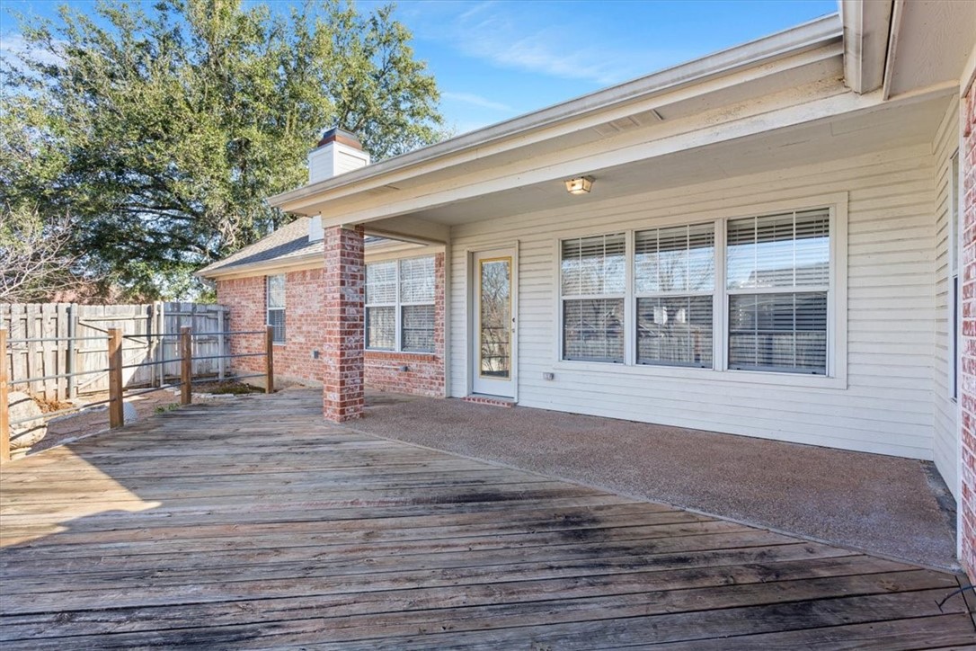 306 Baker Lane Robinson, TX 76706 - Photo 25 of 28 a view of backyard with large trees and wooden fence
