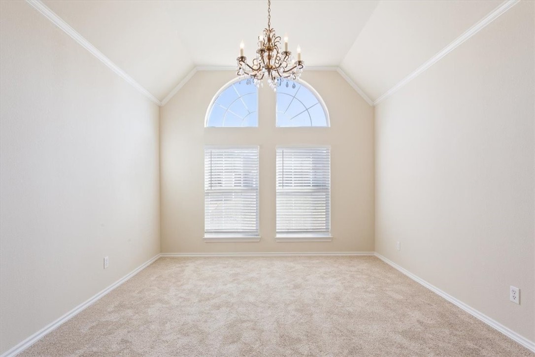 306 Baker Lane Robinson, TX 76706 - Photo 5 of 28 an empty room with chandelier fan and windows