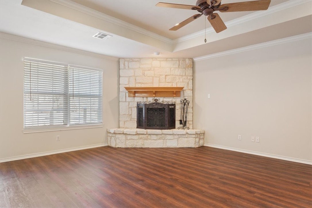 306 Baker Lane Robinson, TX 76706 - Photo 9 of 28 a view of an empty room with a fireplace and a window