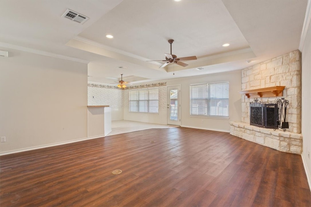306 Baker Lane Robinson, TX 76706 - Photo 10 of 28 an empty room with wooden floor and windows
