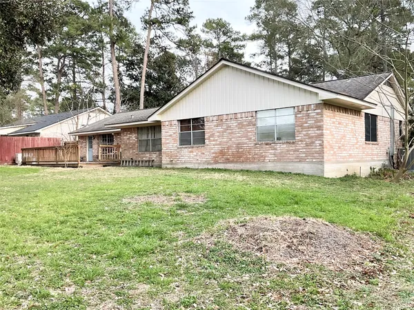 a view of house with yard