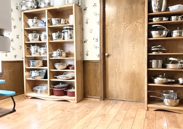 a view of an empty room with shelves