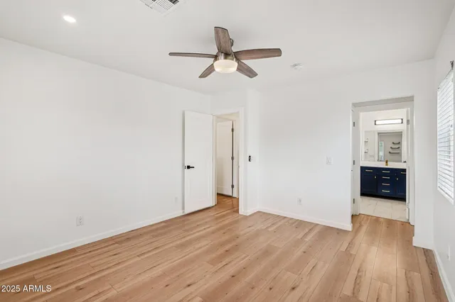 a view of an empty room and a window