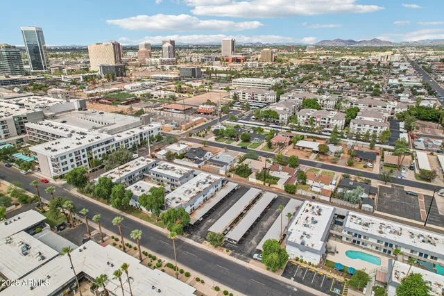 an aerial view of city and lake