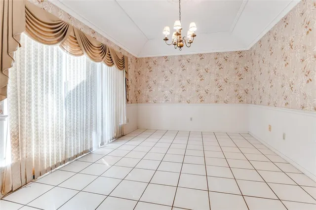 a view of an empty room and a window