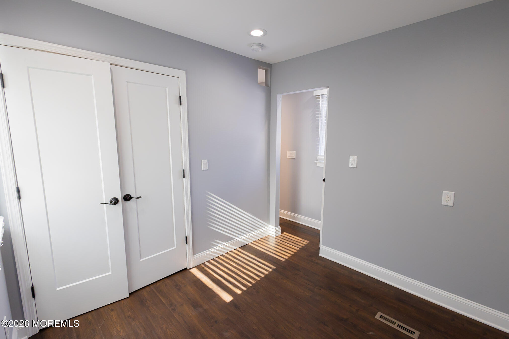 20 Grace Lane Howell, NJ 07731 - Photo 11 of 20 a view of a hallway with wooden floor