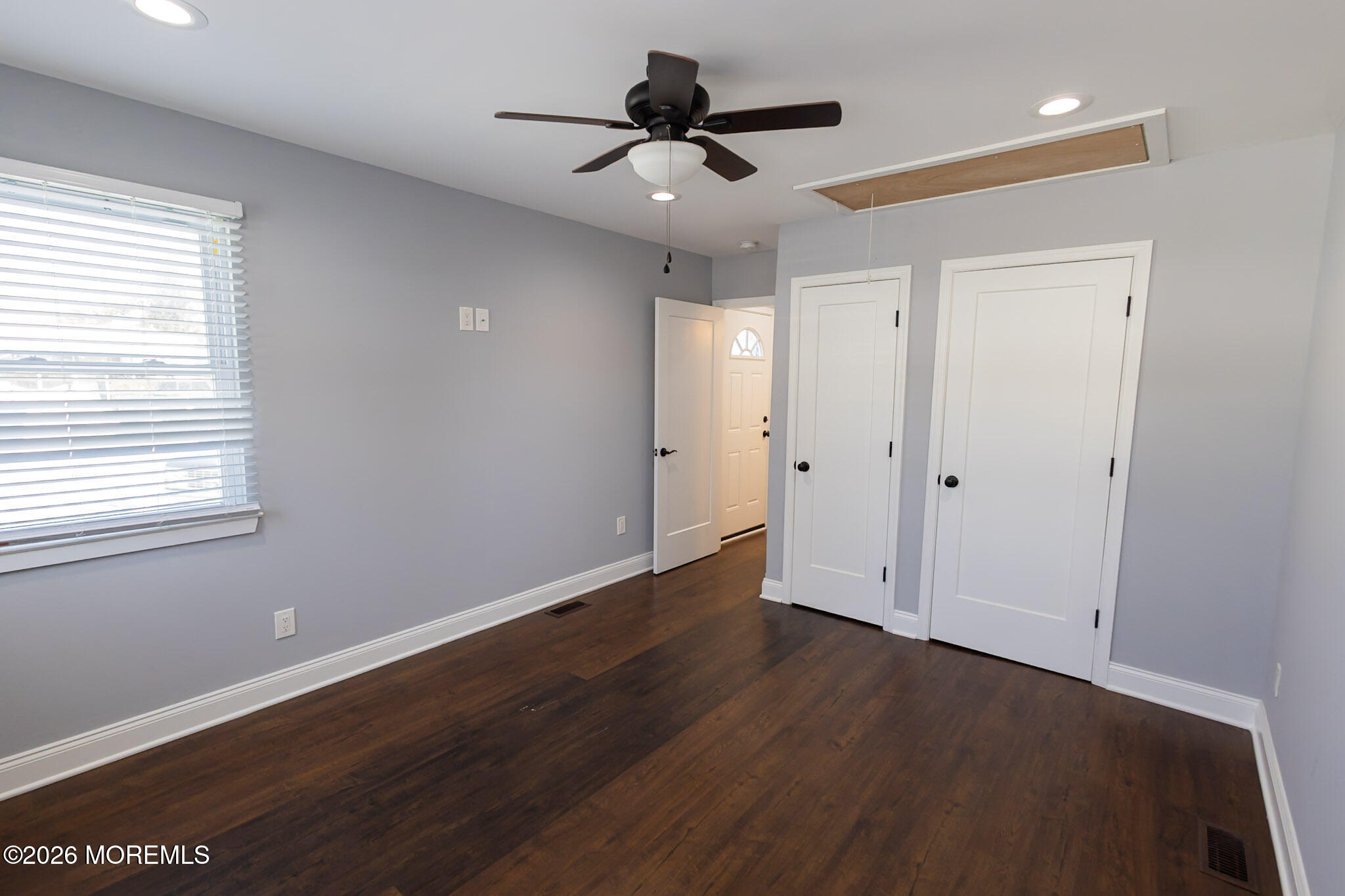 20 Grace Lane Howell, NJ 07731 - Photo 12 of 20 a view of an empty room with wooden floor and a ceiling fan