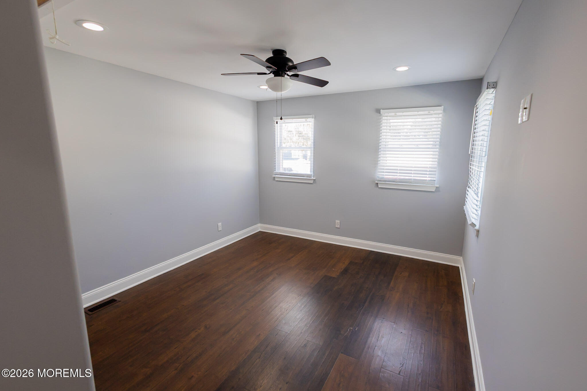 20 Grace Lane Howell, NJ 07731 - Photo 13 of 20 an empty room with wooden floor and windows