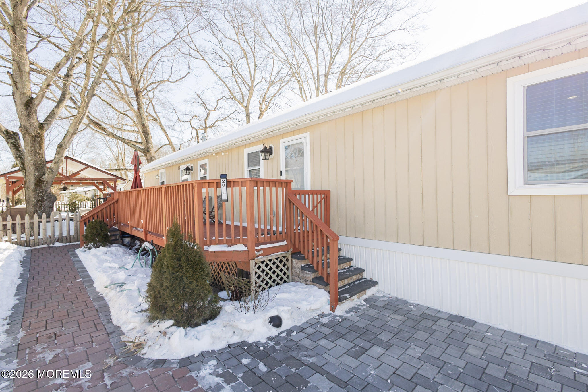 20 Grace Lane Howell, NJ 07731 - Photo 16 of 20 a view of a backyard with a small deck and wooden fence