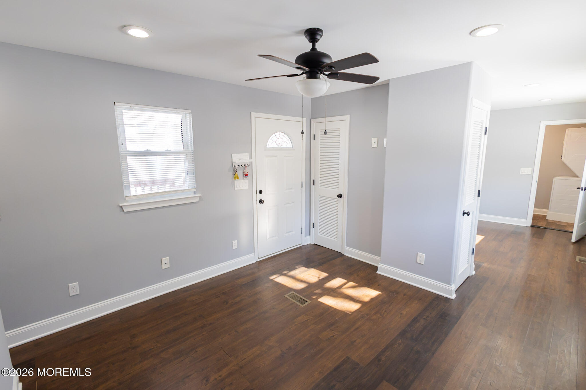 20 Grace Lane Howell, NJ 07731 - Photo 4 of 20 a view of empty room with wooden floor and fan