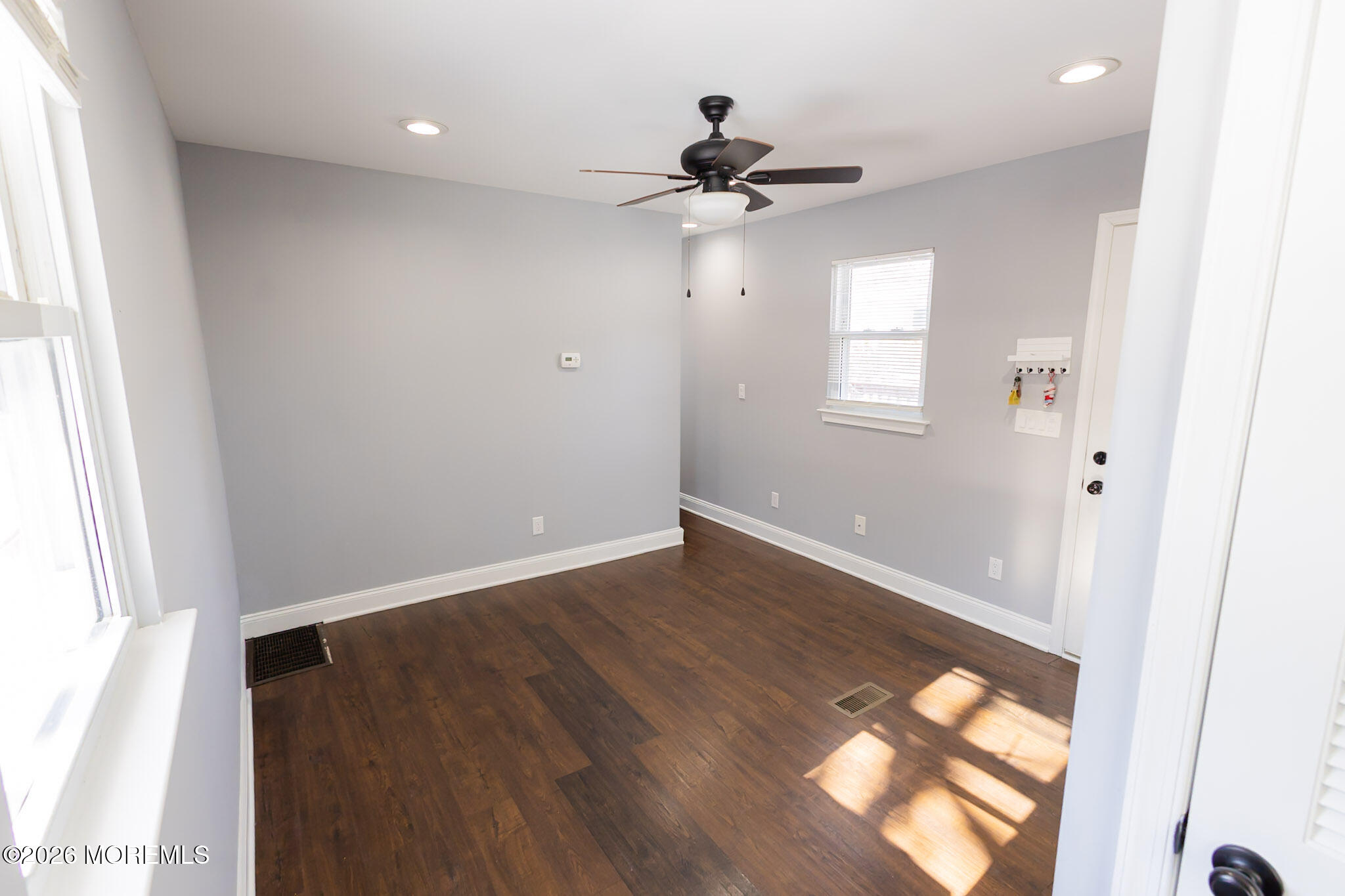 20 Grace Lane Howell, NJ 07731 - Photo 6 of 20 a view of an empty room with wooden floor and a window