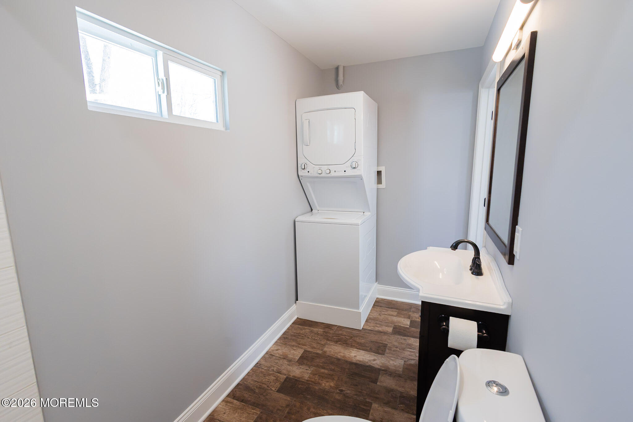 20 Grace Lane Howell, NJ 07731 - Photo 7 of 20 a bathroom with a toilet a sink a mirror and vanity