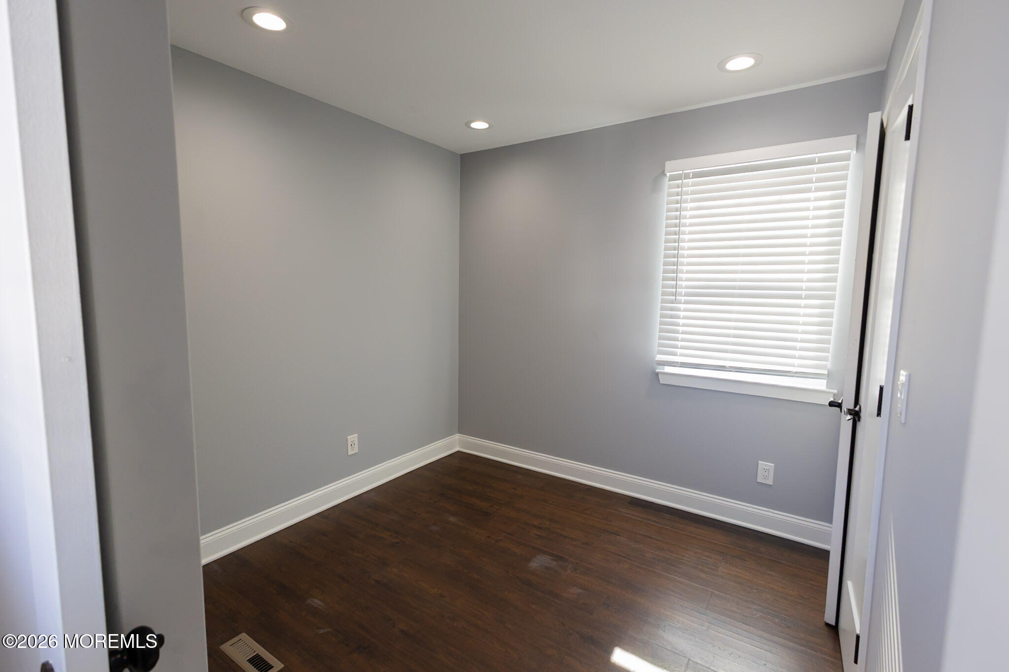 20 Grace Lane Howell, NJ 07731 - Photo 10 of 20 a view of a big room with wooden floor and windows