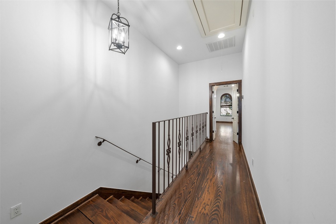 2601 Bevis Street, Unit E Houston, TX 77008 - Photo 28 of 47 Bright third-floor landing with rich wood floors and
elegant iron railing overlooking the staircase below.
This level connects the spacious primary suite and
additional Bedroom, offering a private and quiet
retreat within the home.