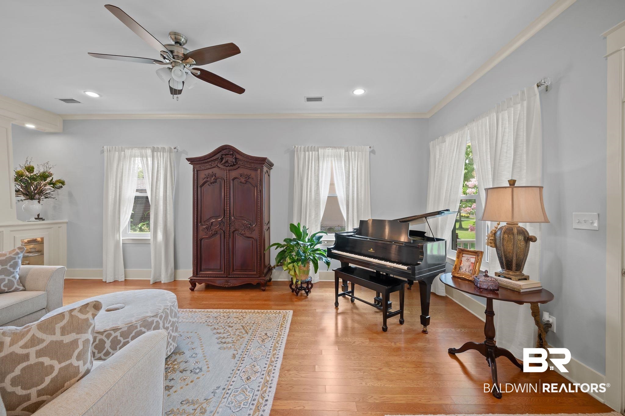 905 Buttercup Lane Foley, AL 36535 - Photo 16 of 47 Living area featuring crown molding, ceiling fan, light wood finished floors, and recessed lighting
