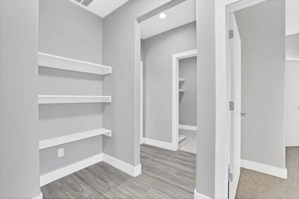 a view of an empty walk in closet