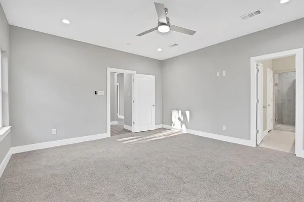 a view of an empty room with a chandelier