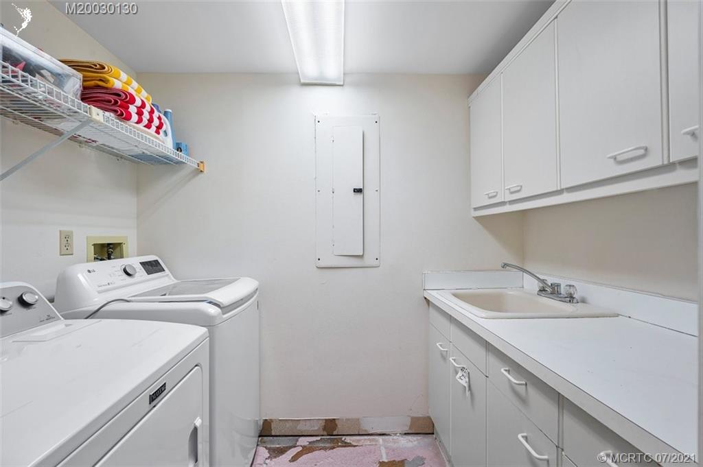 2824 Southeast Dune Drive, Unit 2102 Jensen Beach, FL 34957 - Photo 15 of 40 a utility room with dryer and washer