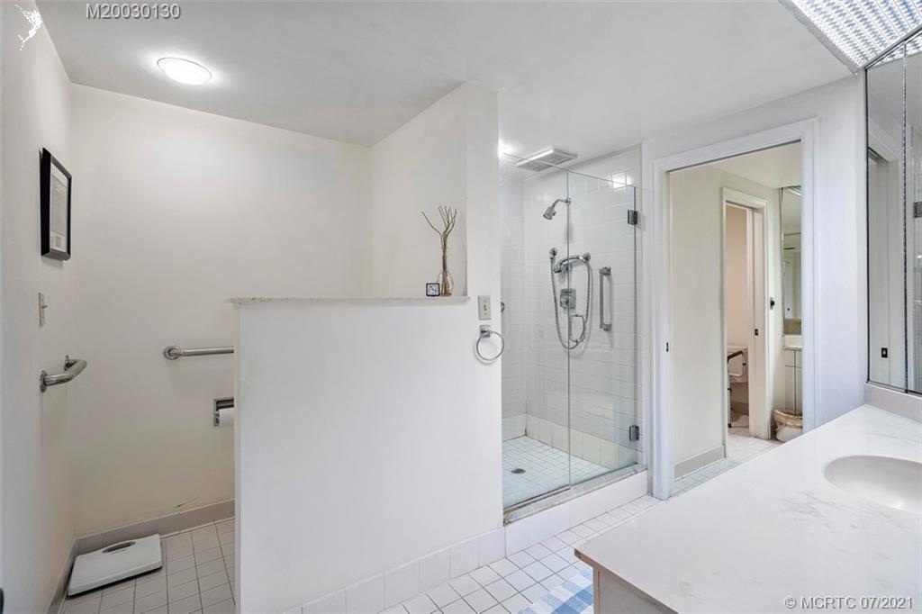 2824 Southeast Dune Drive, Unit 2102 Jensen Beach, FL 34957 - Photo 23 of 40 a bathroom with a shower and a sink