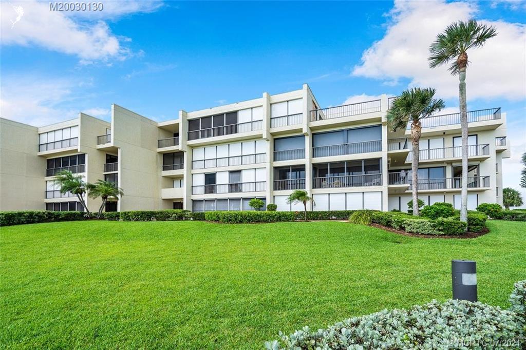 2824 Southeast Dune Drive, Unit 2102 Jensen Beach, FL 34957 - Photo 30 of 40 a view of building with yard
