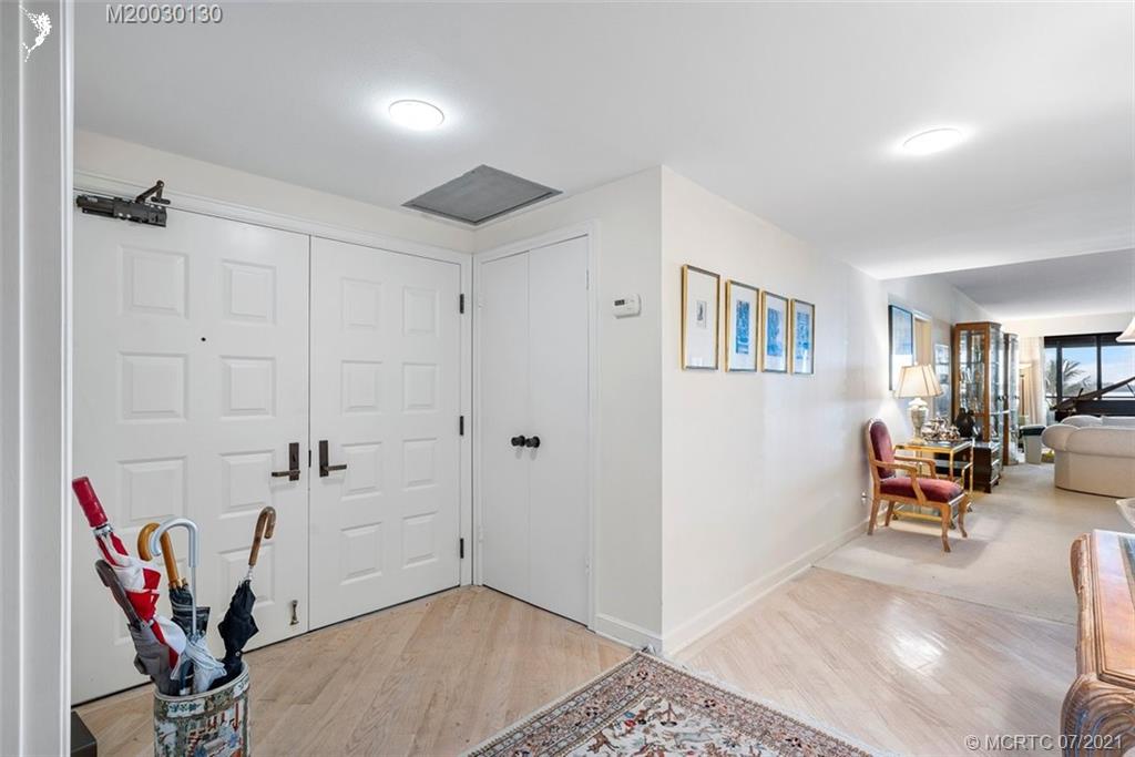 2824 Southeast Dune Drive, Unit 2102 Jensen Beach, FL 34957 - Photo 3 of 40 a view of a livingroom with furniture and gym equipment
