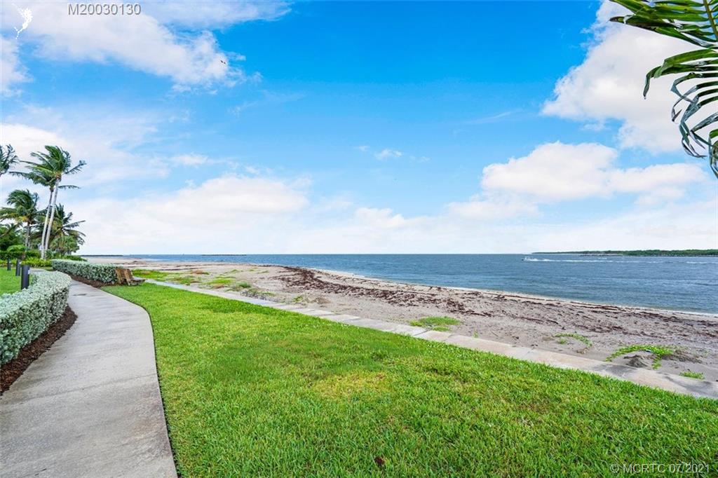 2824 Southeast Dune Drive, Unit 2102 Jensen Beach, FL 34957 - Photo 31 of 40 a view of a ocean with a big yard