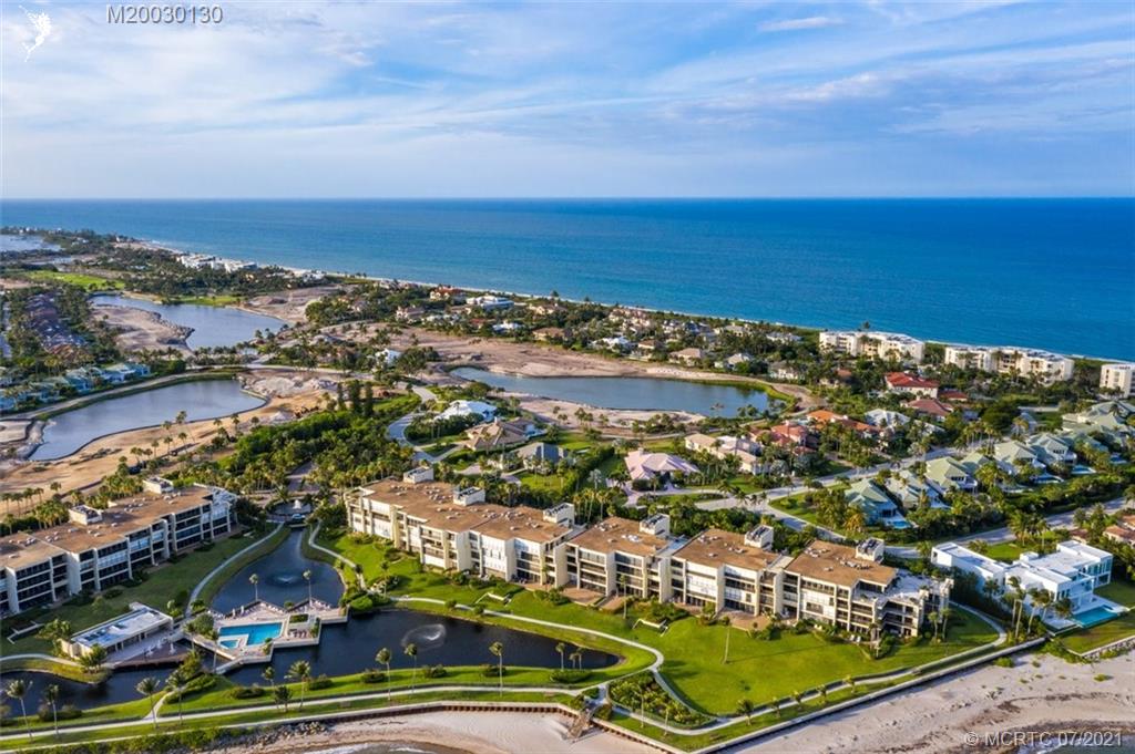 2824 Southeast Dune Drive, Unit 2102 Jensen Beach, FL 34957 - Photo 34 of 40 an aerial view of residential houses with outdoor space