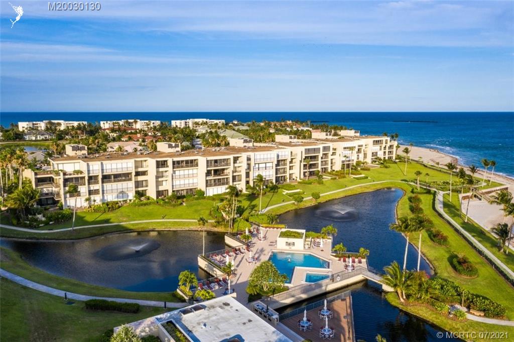 2824 Southeast Dune Drive, Unit 2102 Jensen Beach, FL 34957 - Photo 35 of 40 a view of swimming pool with outdoor seating
