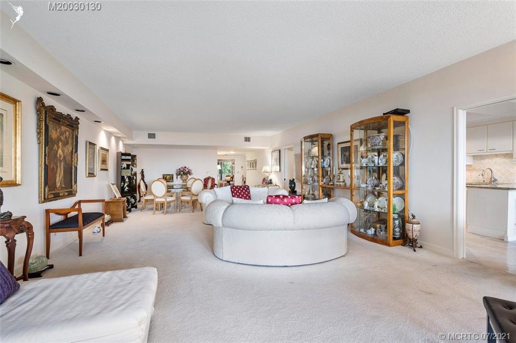 2824 Southeast Dune Drive, Unit 2102 Jensen Beach, FL 34957 - Photo 8 of 40 a living room with furniture and a gym