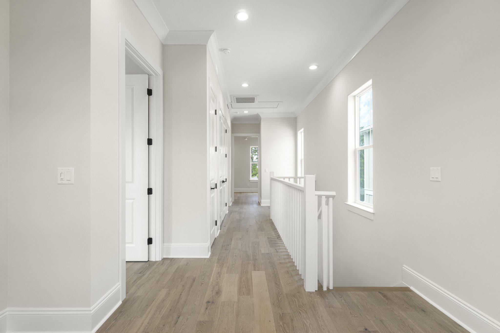 25 Sunset Key Inlet Beach, FL 32461 - Photo 20 of 32 a view of a hallway with wooden floor